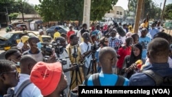 People gather outside the Thies, Senegal, courthouse on Thursday, when a judge dismissed a lawsuit by a fishermen’s collective against a fishmeal factory they accused of polluting their village and destroying their livelihoods.