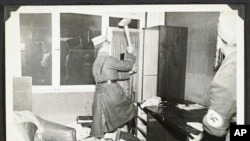 German Nazis ransack Jewish property during Kristallnacht intake most likely in the town of Fuerth, Germany, Nov. 10, 1938, in this photo released by Yad Vashem, the World Holocaust Remembrance Center. 