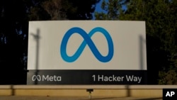 Meta's logo can be seen on a sign at the company's headquarters in Menlo Park, Calif., Nov. 9, 2022. Meta, which is Facebook's parent company, announced it is laying off 11,000 people, about 13% of its workforce.