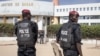 FILE - Police officers stand in front of the courthouse where opposition leader Ousmane Sonko is appearing for a hearing in Dakar, Senegal, Nov. 3, 2022. Senegalese journalist Pape Ale Niang was arrested after publishing articles about rape charges facing Sonko. 