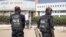 FILE - Police officers stand in front of the courthouse where opposition leader Ousmane Sonko is appearing for a hearing in Dakar, Senegal, Nov. 3, 2022. Senegalese journalist Pape Ale Niang was arrested after publishing articles about rape charges facing Sonko. 