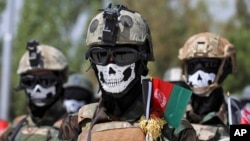 FILE - New Afghan Army special forces members attend their graduation ceremony after a three-month training program at the Kabul Military Training Center in Kabul, Afghanistan, July 17, 2021. 