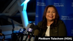 U.S. Sen. Tammy Duckworth smiles on stage with supporters at her victory party at Adler Planetarium in Chicago, IL. Nov 8, 2022.