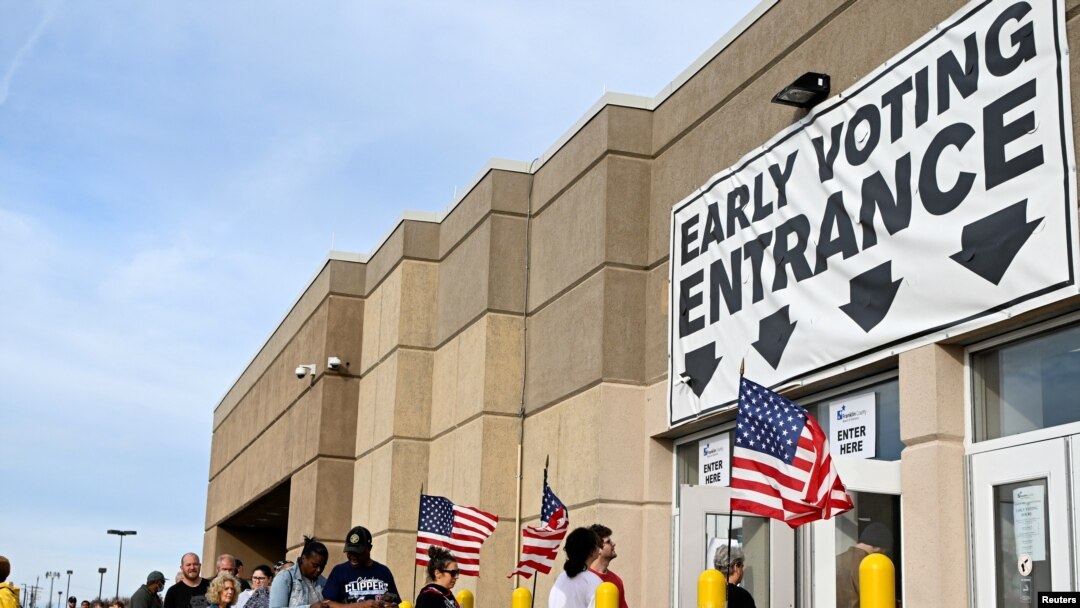 Residents wait in line to cast their ballots for the 2022 midterm election at the Franklin County Board of Elections during early voting hours in Columbus, Ohio, Nov. 5, 2022. 
