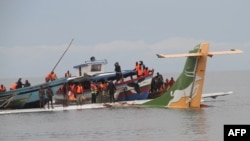 Rescuers search for survivors after a Precision Air flight that was carrying 43 people plunged into Lake Victoria as it attempted to land in the lakeside town of Bukoba, Tanzania, Nov. 6, 2022.