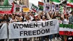 FILE - People in Los Angeles march to protest against the Iranian regime following the death of Mahsa Amini in the custody of the Islamic republic's "morality police" on Oct. 22, 2022. 