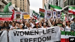 FILE - People in Los Angeles march to protest against the Iranian regime following the death of Mahsa Amini in the custody of the Islamic republic's 'morality police' on Oct. 22, 2022. 
