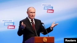 Russian presidential candidate and incumbent President Vladimir Putin speaks at his election campaign headquarters, after polling stations closed on the final day of the presidential election in Moscow, Russia, March 17, 2024.
