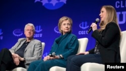FILE - The Clintons – Bill, Hillary and daughter Chelsea – speak at a 2014 Clinton Global Initiative University at Arizona State University in Tempe. Some critics say the Clinton Foundation represents a conflict of interest for the Democratic presidential candidate.