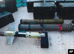 FILE - Confiscated weapons are seen aboard an Iranian fishing boat bound for Yemen in this image from the Saudi Press agency, SPA, Sept. 30, 2015. The Saudi-led coalition battling Yemen's Shiite rebels says it has foiled an attempt by Iran to smuggle weapons into Yemen.