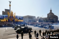 Tanks pass during a military parade marking Ukraine's Independence Day in Kyiv, Ukraine, Aug. 24, 2018.