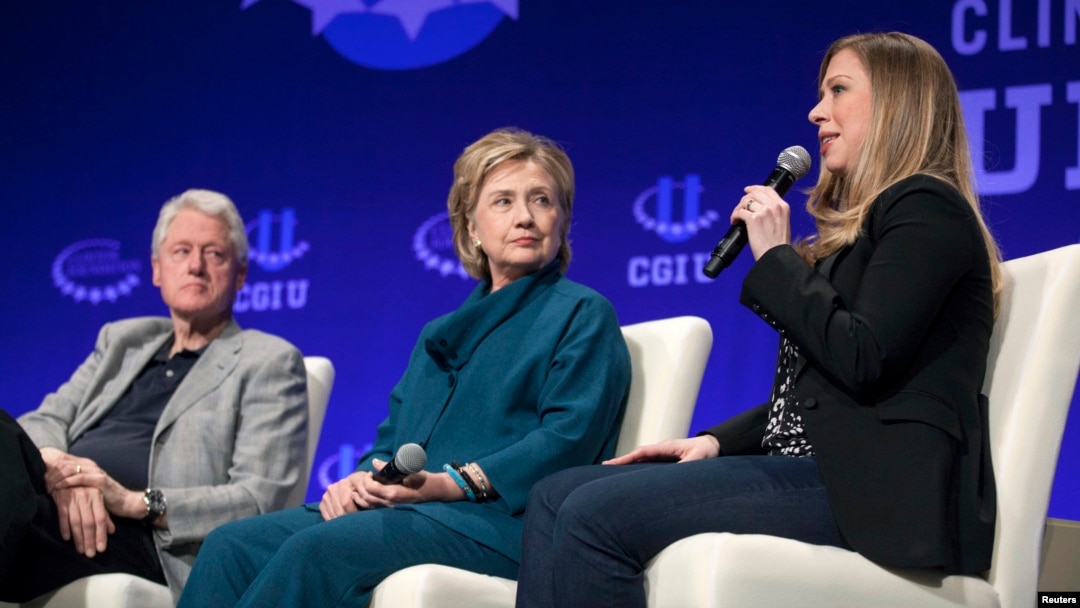 FILE - The Clintons — Bill, Hillary and daughter Chelsea — speak at a 2014 Clinton Global Initiative event at Arizona State University in Tempe. 