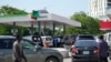 FILE—People queue to buy fuel at a petrol station in Lagos, Nigeria, May 30, 2023. 