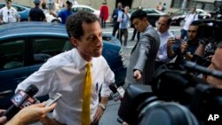 Former congressman Anthony Weiner, at the time a New York City mayoral candidate, is seen speaking to members of the media in New York, July 24, 2013. In an odd twist, the contents of his computer might now well determine who will next occupy the White House.