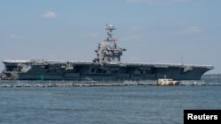  El portaaviones estadounidense Harry S. Truman parte con su grupo de batalla hacia el Medio Oriente, desde la estación naval de Norfolk, en Virginia. Abril 11 de 2018.