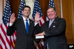 House Speaker Paul Ryan of Wis. administers the House oath of office to Rep. Ken Calvert, R-Calif., during a mock swearing in ceremony on Capitol Hill in Washington, Jan. 3, 2017.