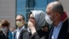 FILE - Hatice Cengiz, the fiancee of slain Saudi journalist Jamal Kashoggi, leaves a court in Istanbul, July 3, 2020, during the trial in absentia of two former aides of Saudi Crown Prince and 18 other Saudi nationals in the killing of Jamal Kashoggi.
