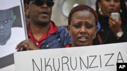 FILE - Protesters demonstrate outside U.N. headquarters in New York, calling for an end to political atrocities and human rights violations unfolding in Burundi under the government of President Pierre Nkurunziza, April 26, 2016.
