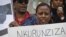FILE - Protesters demonstrate outside U.N. headquarters in New York, calling for an end to political atrocities and human rights violations unfolding in Burundi under the government of President Pierre Nkurunziza, April 26, 2016.