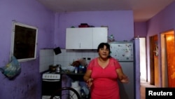 Catalina Benitez speaks during an interview with Reuters in her home in La Matanza, in the greater Buenos Aires area, July 29, 2015. 