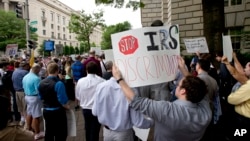 Tea Party supporters gather for a rally outside the IRS headquarter in Washington, May 21, 2013. (AP Photo)