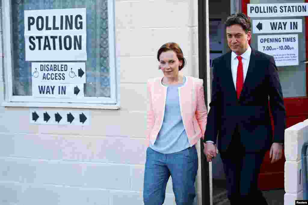 Britain&#39;s opposition Labor Party leader Ed Miliband leaves after voting with his wife Justine in Doncaster, May 7, 2015.