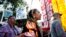 Angela Miracle Gladue, center, a member of the Frog Lake First Nations, a Cree community in Edmonton, Alberta, Canada, attends a rally in support of the Standing Rock Sioux Tribe and in opposition of the Dakota Access oil pipeline, in Lafayette Park near the White House, Sept. 13, 2016, in Washington.