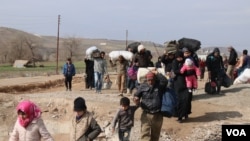 More than 11 million Syrians are displaced at home or abroad, with many having fled their homes several times. Some are pictured here in Manbij, Syria, Feb. 21, 2020. (Heather Murdock/VOA)
