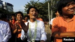 Student activists celebrate outside the prison after being released by the new government's general amnesty in Yangon, Myanmar, April 17, 2016. 