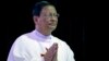 Newly appointed Cardinal Charles Maung Bo prays during a religious service at St. Paul’s Missionary school in suburbs of Yangon, Myanmar, Jan. 5, 2015. 