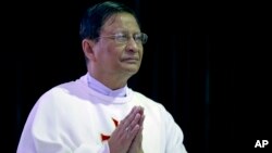 Newly appointed Cardinal Charles Maung Bo prays during a religious service at St. Paul’s Missionary school in suburbs of Yangon, Myanmar, Jan. 5, 2015. 