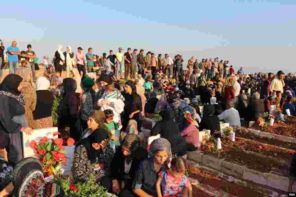 Displaced Afrin people visit the graves of their beloved ones in the eid