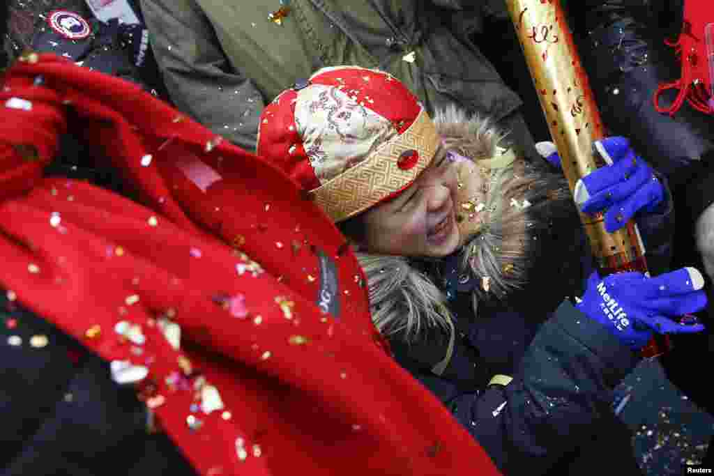 People celebrate the Chinese Lunar New Year in New York, Feb. 19, 2015. 