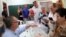 FILE - A man prepares to vote in Spain's general election at a polling station in Rincon de la Victoria, June 26, 2016.