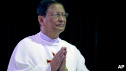 Newly appointed Cardinal Charles Maung Bo prays during a religious service at St. Paul’s Missionary school in suburbs of Yangon, Myanmar, Jan. 5, 2015. 