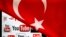 FILE - YouTube logos displayed on a laptop screen partially covered with Turkey's national flag in this photo illustration taken in Ankara, March 27, 2014. 