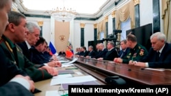 RUSSIA -- Russian President Vladimir Putin (C) chairs a Security Council meeting in Moscow, April 6, 2018