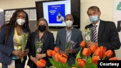 Netherlands' Ambassador to the U.S. Andre Haspels, right, took Dutch tulips to health workers at the United Medical Center in Washington on April 21, 2021. Photo courtesy of the Embassy of the Netherlands in the United States.