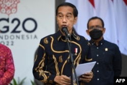 Indonesia's President Joko Widodo gives a speech at the launch of the first public electric vehicle charging station, which will be used for electric vehicles transporting leaders during the G20 conference this year, on Indonesia's resort island of Bali o