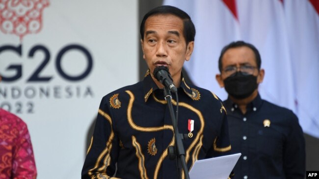 Indonesia's President Joko Widodo gives a speech at the launch of the first public electric vehicle charging station, which will be used for electric vehicles transporting leaders during the G20 conference this year, on Indonesia's resort island of Bali on March 25, 2022.