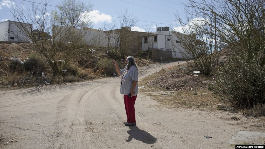 A local woman named Maria shows her property where migrants hide as they await rides in Sunland Park, New Mexico, U.S. on March 23, 2022. (REUTERS/Adria Malcolm)