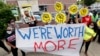 FILE - Protesters rally outside in Detroit for a national workers strike, July 20, 2020. The strike saw people walk off their jobs to protest systemic racism and economic inequality.