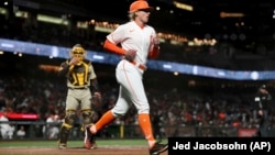 San Francisco Giants first base coach Alyssa Nakken runs to get in position at a baseball game in San Francisco, Tuesday, April 12, 2022.
(AP Photo/Jed Jacobsohn)
