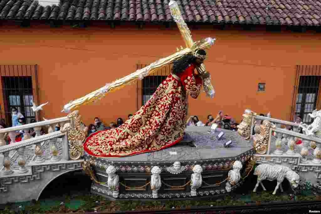 Catholic faithful take part in the Palm Sunday procession in Antigua, Guatemala, April 10, 2022.