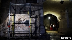 A stone slab said to be the decorated frontal of the Crusader-era high altar of the Church of the Holy Sepulchre. REUTERS/Ronen Zvulun