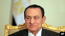 FILE - Egyptian President Hosni Mubarak attends a meeting with Emirates foreign minister at the Presidential palace in Cairo, Egypt, Feb. 8, 2011. 