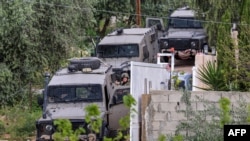 Israeli army soldiers take part in a military operation in Jenin in the occupied West Bank on April 12, 2022. 