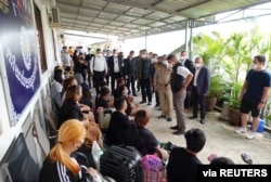 FILE - Pol Lt Gen Surachate Hakparn, Assistant to Thai Police Commissioner speaks to Thai victims rescued from scam call centres in Phnom Penh, Cambodia, in this undated handout picture released by Thai police on April 12, 2022.