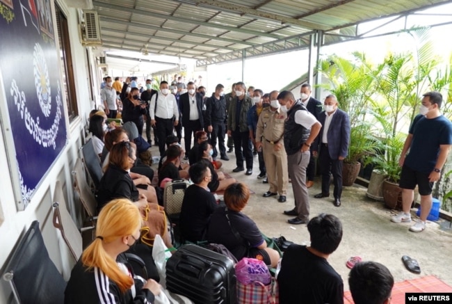 FILE - Pol Lt Gen Surachate Hakparn, Assistant to Thai Police Commissioner speaks to Thai victims rescued from scam call centres in Phnom Penh, Cambodia, in this undated handout picture released by Thai police on April 12, 2022.