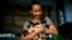 Grettel Montes de Oca Valdes, a professional dancer and founder of the group Cubans in Defense of Animals poses with four kittens that she has received in her house in Havana, Cuba, April 4, 2019.